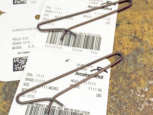 Tag Clips for Attaching Tags to Industrial Products