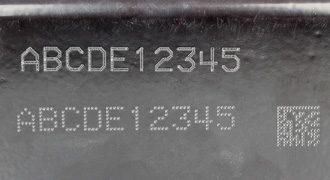 text and Data Matrix code stamped onto painted metal part surface