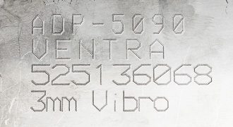 lines of text vibropeen etched onto metal part surface