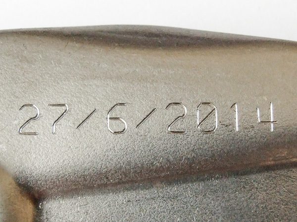 date code scribed onto a metal part