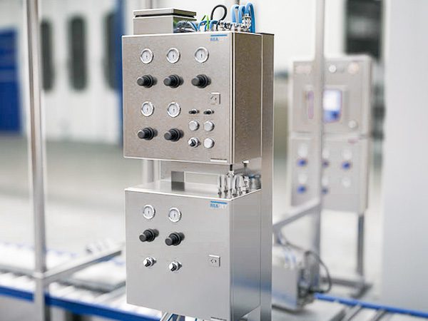 STF spray system cabinet with automatic controls mounted on a production line