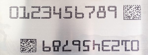 sample print of large character text and a 2D Data Matrix bar code on aluminum product