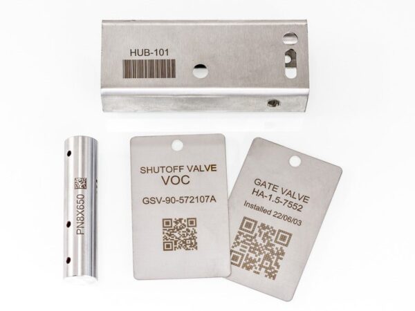 two metal parts and two metal equipment tags